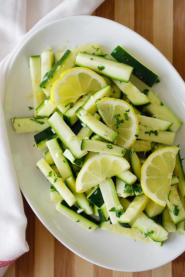 Sauteed zucchini recipe with garlic butter on a plate, ready to serve.