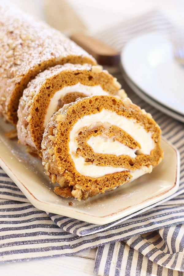 Easy homemade fall pumpkin roll cake, served in a serving dish.