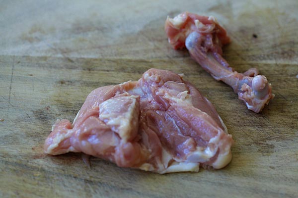 Learn the easy step-by-step to debone chicken thighs so you keep the skin on, but with no bones | rasamalaysia.com