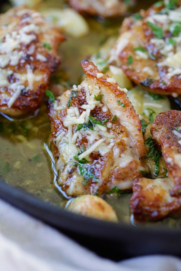 Quick and easy skillet butter garlic chicken topped with parmesan cheese ready to serve.