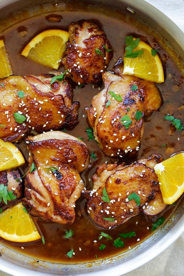 Honey Orange Chicken in a skillet with savory, sweet and tangy honey orange sauce.
