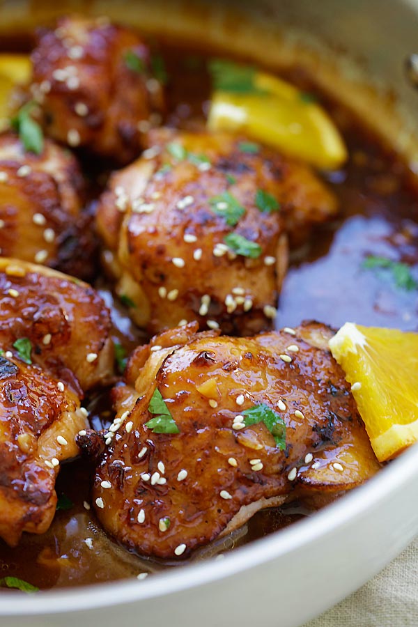 Asian homemade sauteed Honey Orange Chicken in a skillet ready to serve.