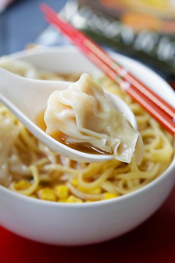 Shrimp Wonton Soup with a whole shrimp wonton in a spoon.