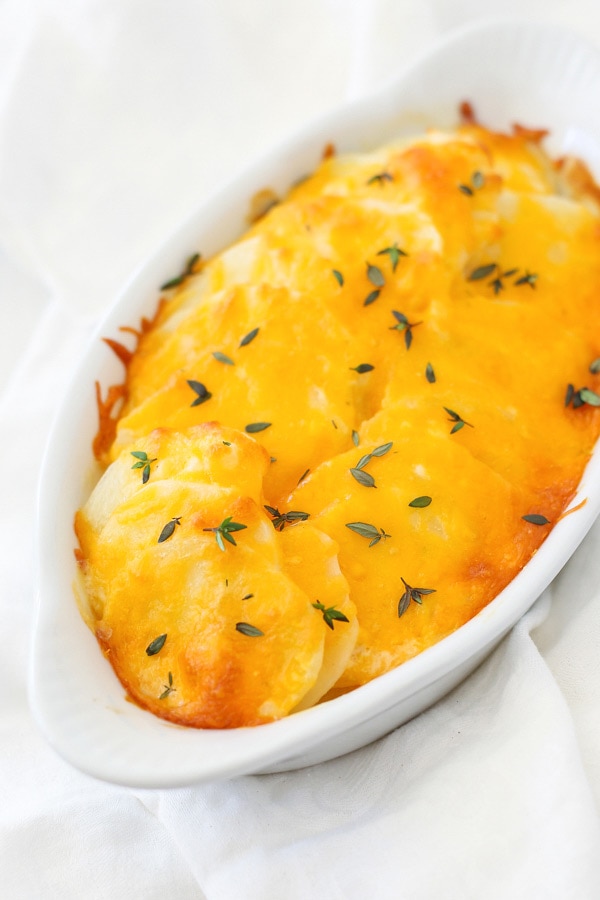 Baked golden Scalloped Potatoes in a baking dish, ready to serve.