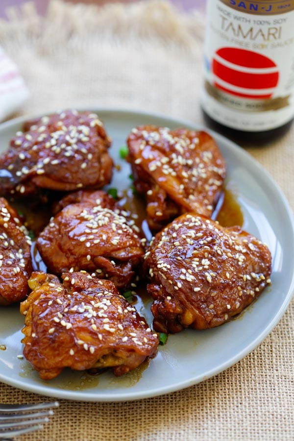 Slow Cooker Sesame Chicken marinade with San-J Tamari and sesame sauce serve in a plate.