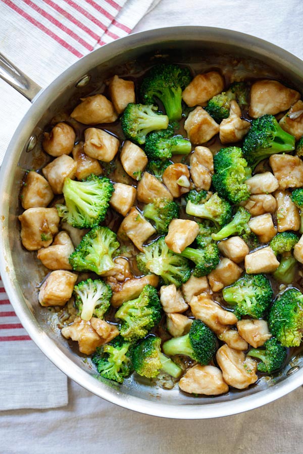Delicious Chinese chicken and broccoli in brown sauce in white serving dish, ready to serve.