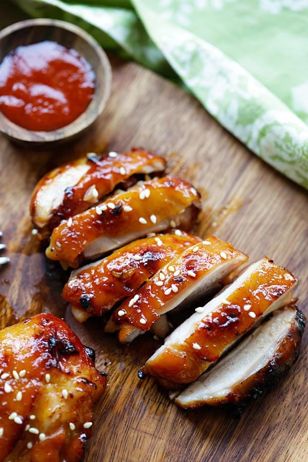 Sliced grilled chicken with golden sriracha sauce and honey marinade glaze.