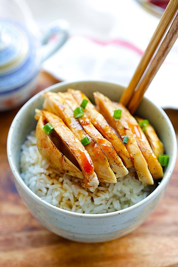 Popular Chinese chicken dish with sweet and savory Mandarin sauce in a bowl on top of steamed rice.