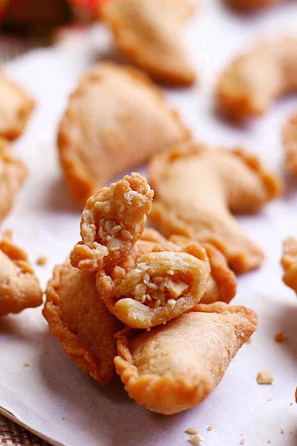 Easy and delicious deep fried golden peanut puffs in half.