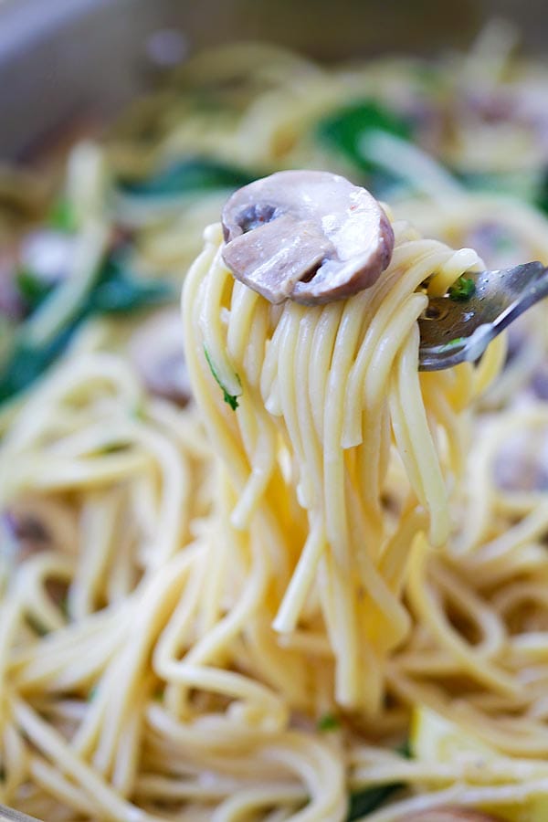 Creamy Mushroom spaghetti Pasta with rich mushroom sauce, twirled in a fork.