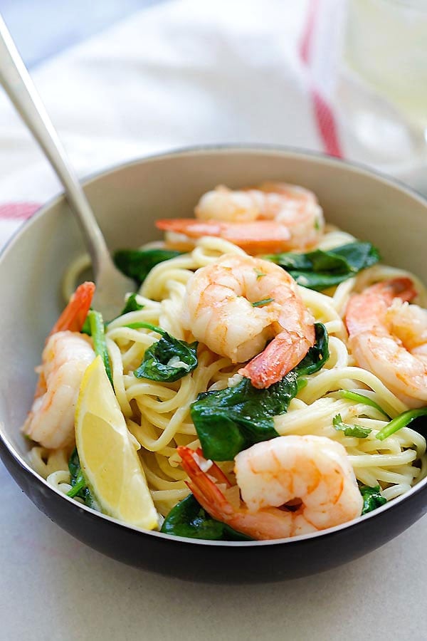 Healthy Italian shrimp and spinach spaghetti pasta in homemade easy garlic butter sauce.