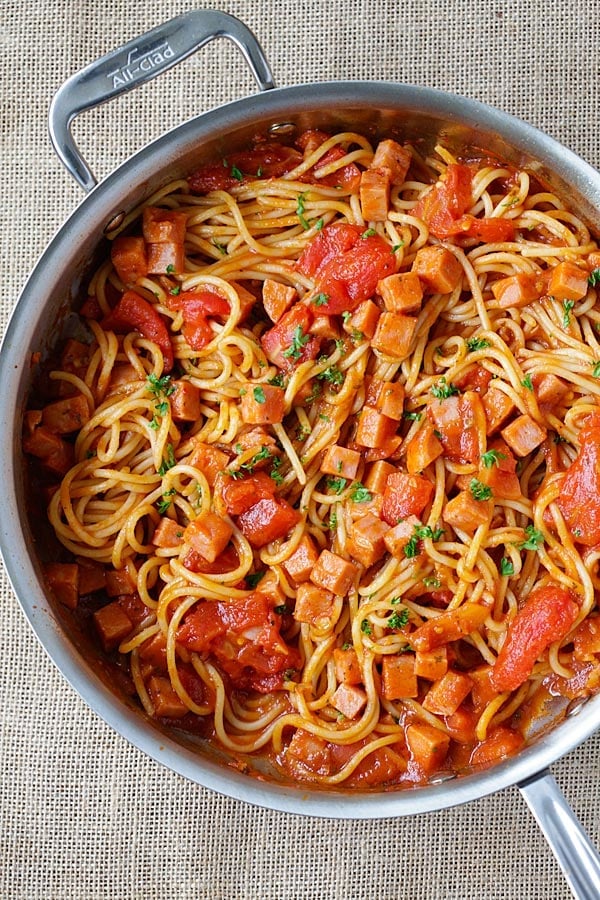 Easy and quick spaghetti pasta with spam meat and tomato sauce in one pot.