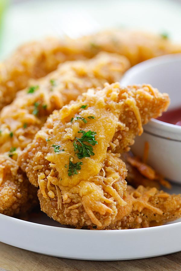 Easy and quick oven baked chicken tenders with cheddar cheese and garlic.