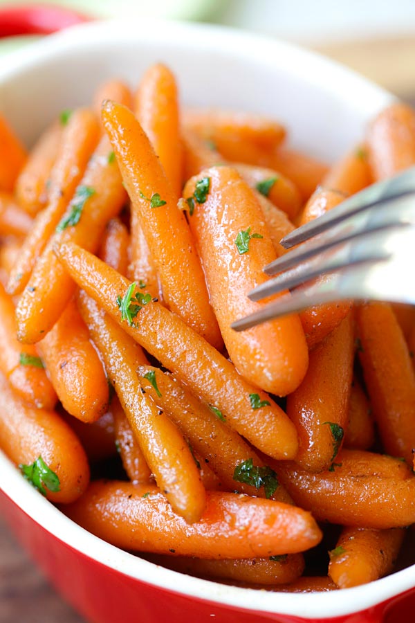 Healthy and easy skillet candies carrots with a fork.