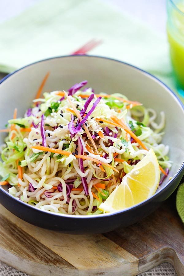 Asian ramen noodle salad with ramen noodles, cabbage and carrots in a tangy and appetizing dressing serve in a bowl.