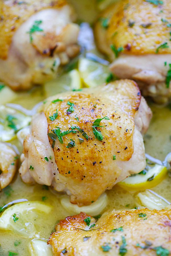 Close up of lemon chicken recipe covered in rich lemon butter sauce ready to serve.