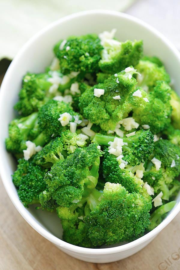 Broccoli florets sauteed with garlic served in a bowl. 