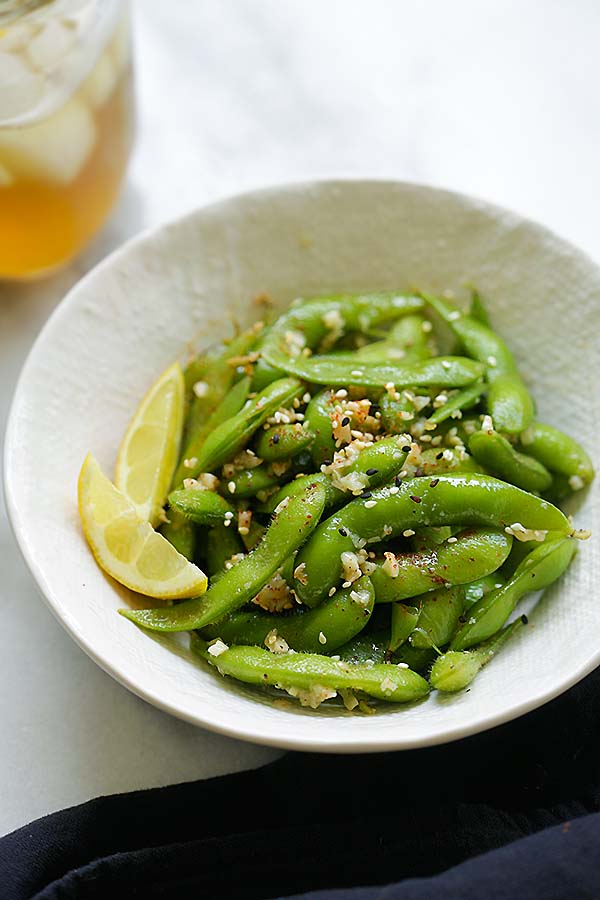 Edamame beans with garlic and butter served in a plate.
