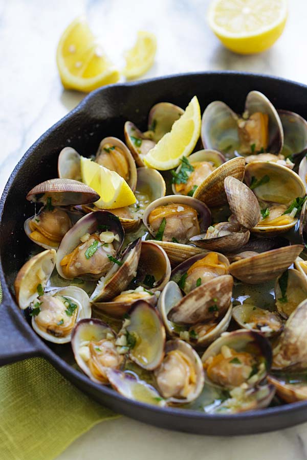 Skillet garlic butter clams sauteed with lemon, white wine and parsley.