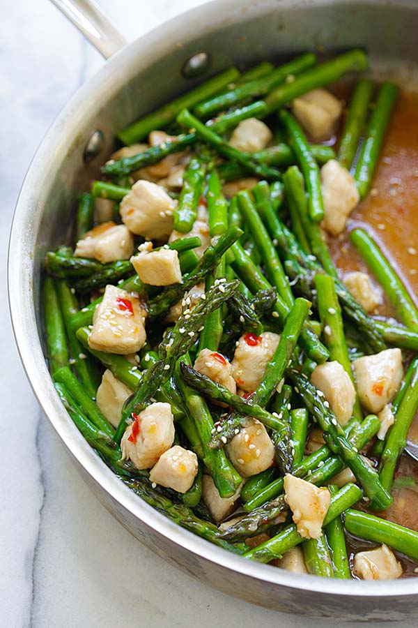 Chicken and asparagus recipe with Asian stir fry brown sauce, ready to serve.