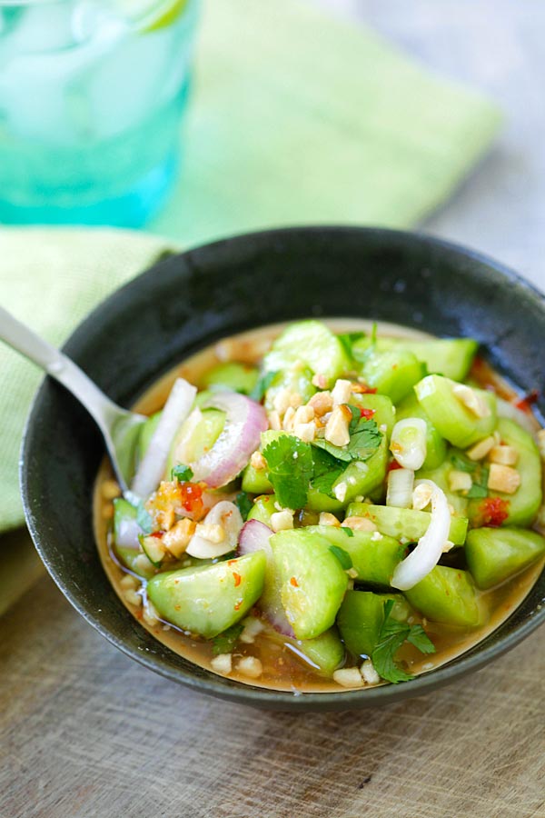 Cucumber Salad recipe made as a side dish in a bowl, covered in delicious Thai sauce.