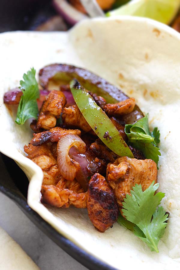 Healthy Mexican Chicken Fajita folded in a tortilla.