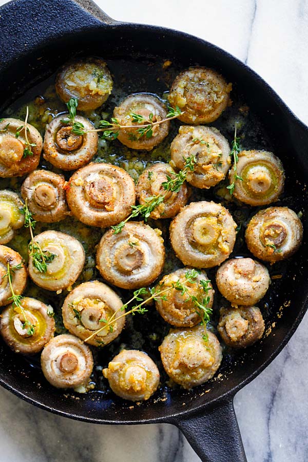 Sauteed garlic thyme roasted mushrooms in a skillet.