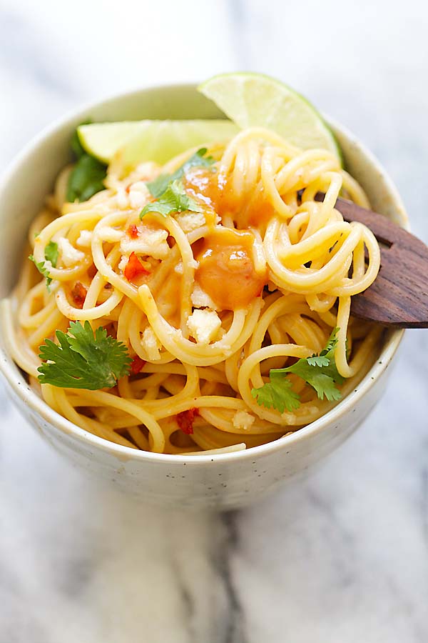 4 ingredients Thai sweet chili peanut noodles in a bowl with a fork.