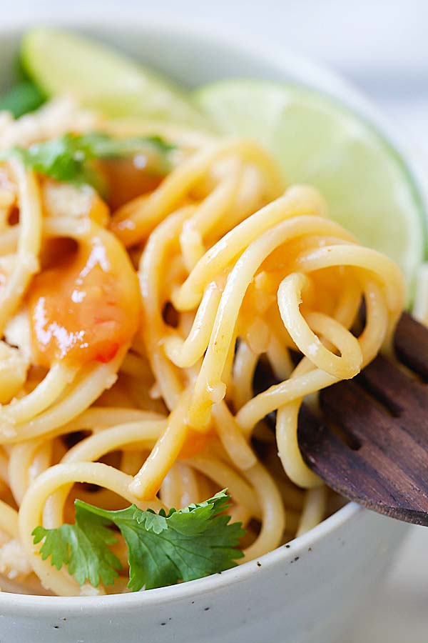 Thai sweet chili peanut noodles twirled in a fork.
