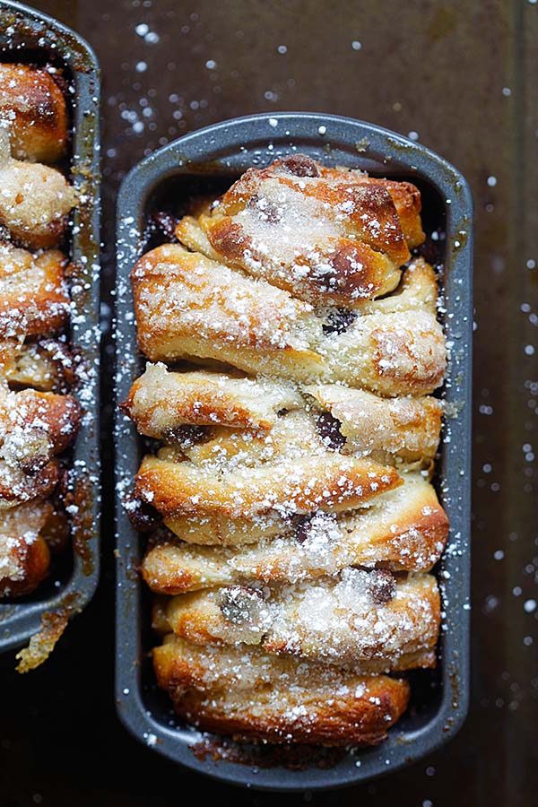 Easy homemade baked chocolate-cinnamon pull-apart bread in baking tray.