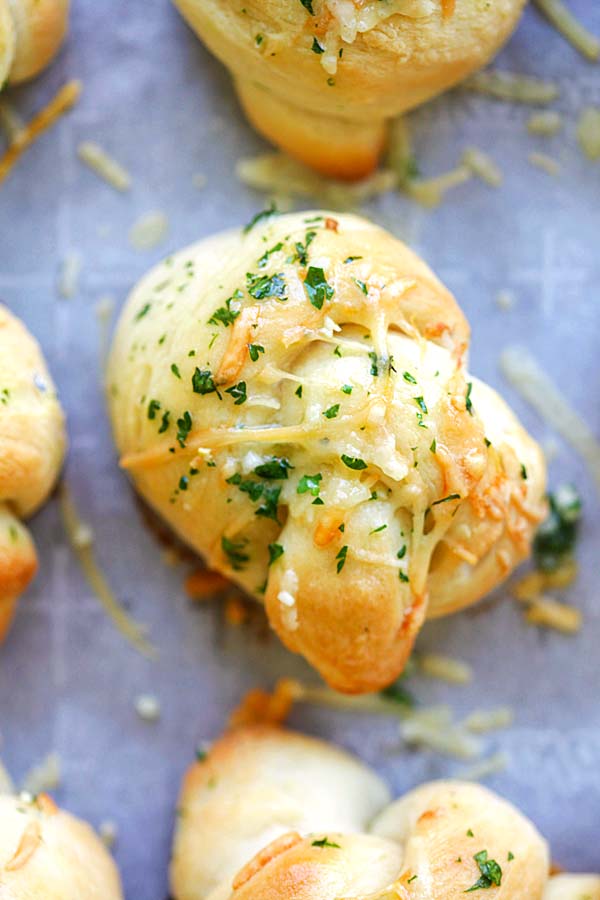 Homemade dinner rolls with Parmesan cheese and garlic butter.