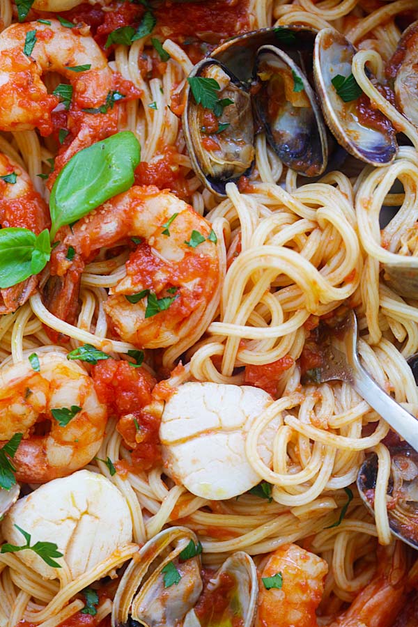 Mixed seafood pasta cooked in one pot with fresh tomato sauce, ready to serve.