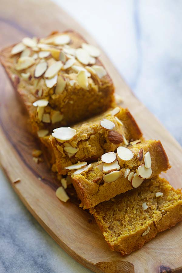 Easy homemade baked pumpkin pound cake made with pumpkin and pumpkin pie spice topped with sliced almond nuts.
