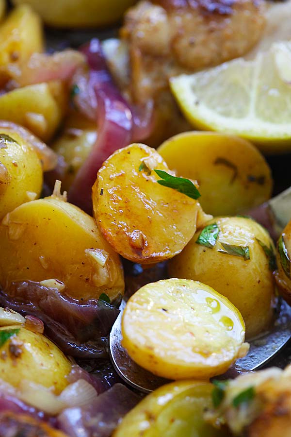 Close up soft baked potatoes with chicken the Spanish style ready to serve.