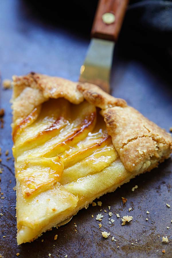 Close up of a slice of baked apple tart on serving spatula