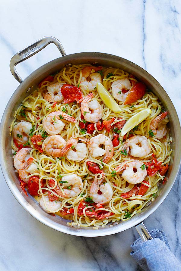 Creamy shrimp and sun-dried tomatoes pasta in a pot.