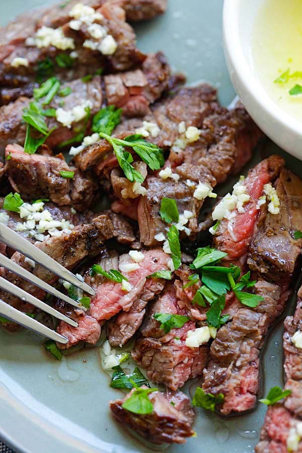 Easy and quick garlic butter Brazilian steak in a plate with homemade garlic butter sauce.