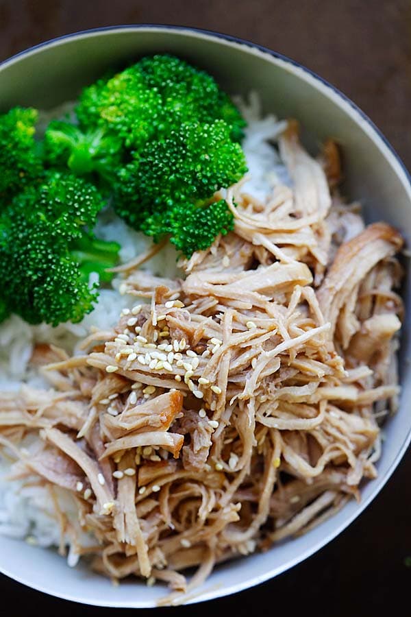 Quick and easy Hawaiian Kalua chicken garnished with sesame seeds.