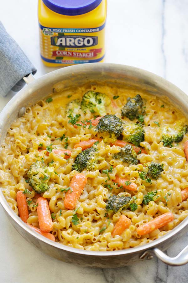 Healthy vegetable mac and cheese with broccoli and carrots in skillet.