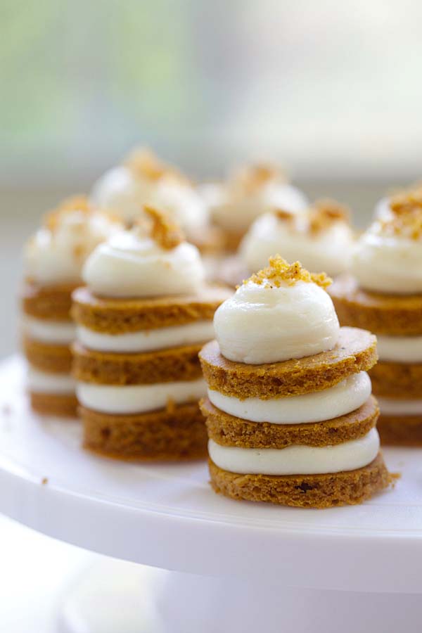 Easy homemade festive mini pumpkin layer cake served on a cake stand.