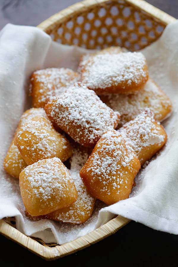 Beignets New Orleans dusted with powdered sugar.