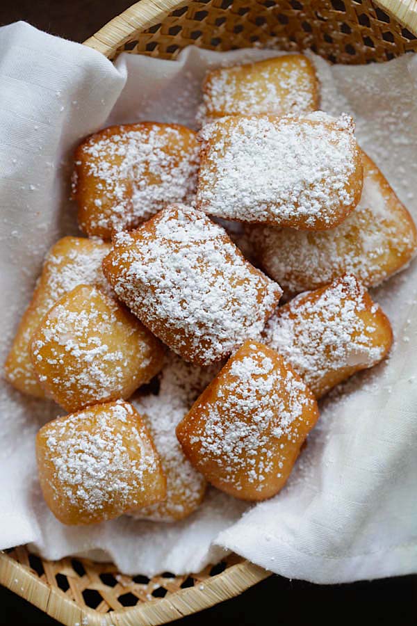 Overhead photo of New Orleans beignets, a famous fried sweet fritters in New Orleans.