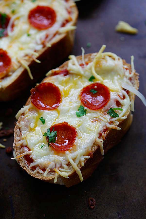 Homemade easy baked Texas garlic bread toast topped with pizza sauce, mozzarella cheese and pepperoni, ready to serve.