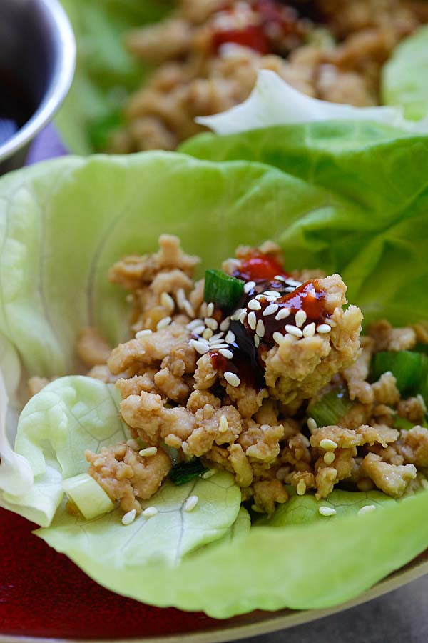 Healthy homemade lettuce wraps with minced turkey topped with Hoisin-Sriracha dipping sauce.