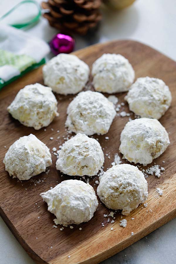 Easy and quick homemade chocolate chips snowballs and pecan cookies coated with powdered sugar.