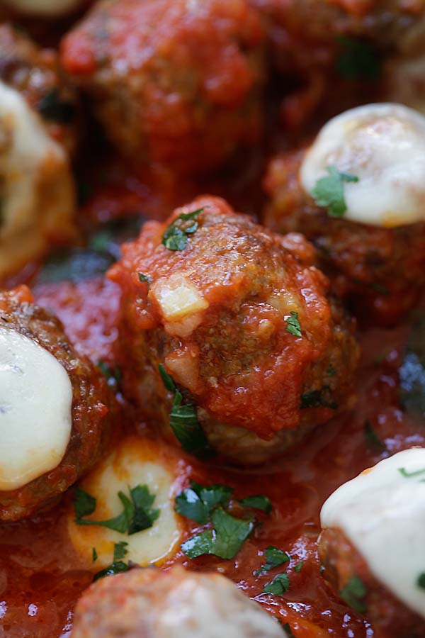 homemade beef meatballs in one pot with tomato sauce and mozzarella cheese.