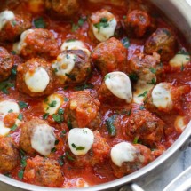 Casserole with ground beef meatballs, tomato sauce and cheese.