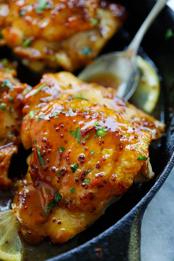 Spicy honey-glazed chicken thigh close up.