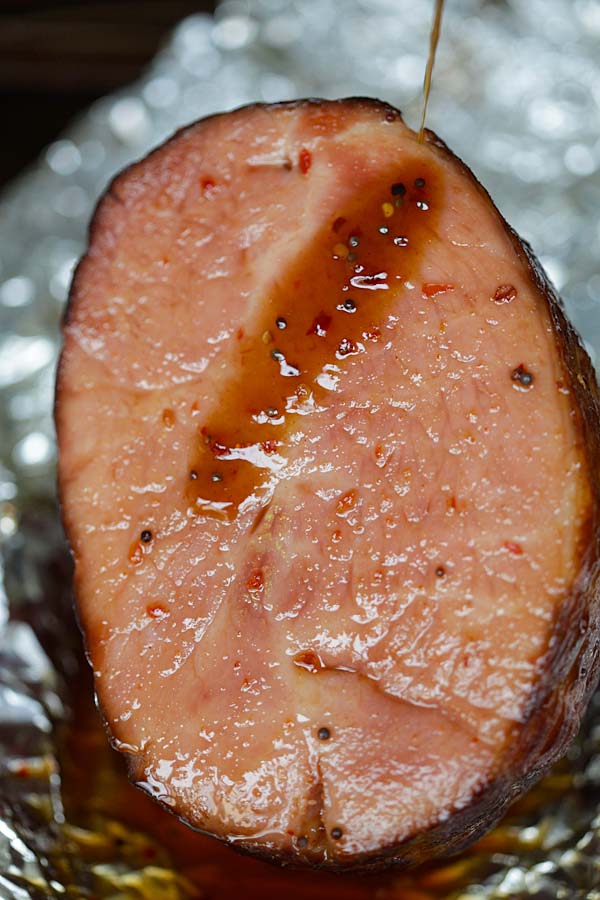 Glaze ham by adding the honey glaze on pre-cooked ham wrapped in a foil.