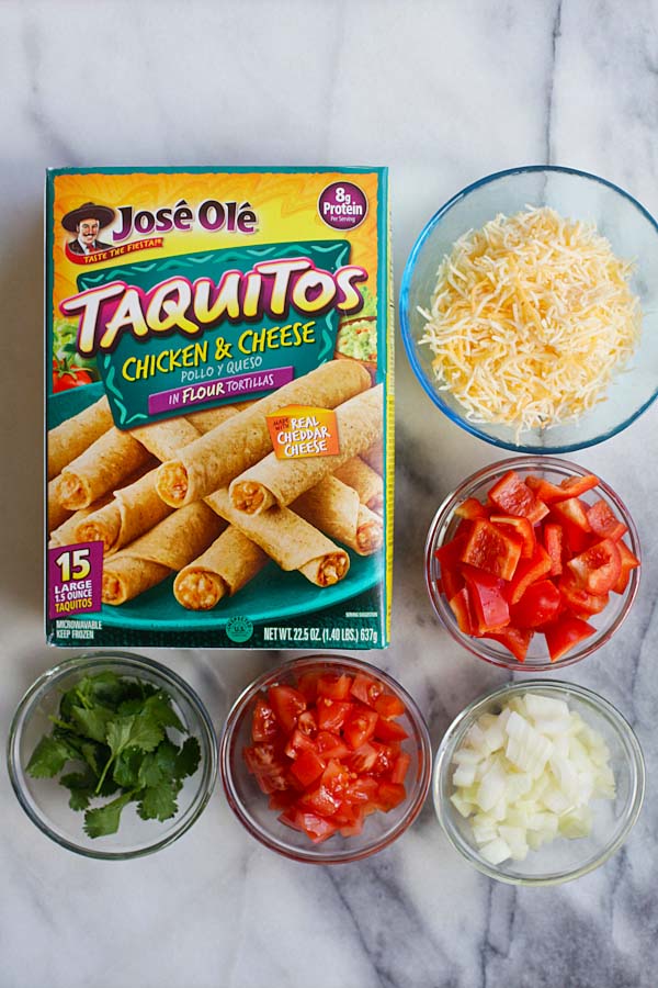 Mexican Taquitos ingredients that consists of Jose Ole Taquitos flour, diced onions, bell peppers, chopped tomatoes, shredded cheese and cilantro leaves.